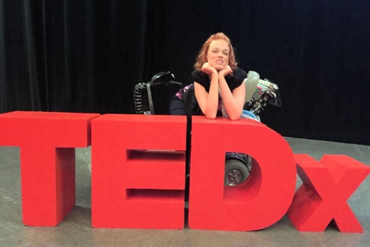 Josie posing behind a Gaint TEDx sculpture