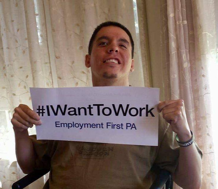 Kyle with I Want To Work sign